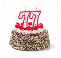 32579630-Birthday-cake-with-burning-candle-number-77-Stock-Photo.jpg