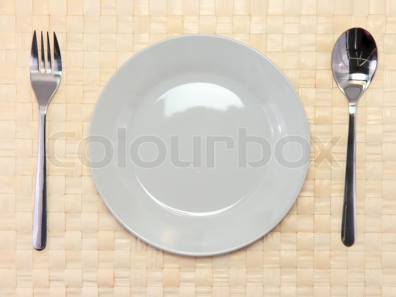 2071794-table-appointment-plate-fork-spoon-on-red-bamboo-mat-all-around-isolated.jpg