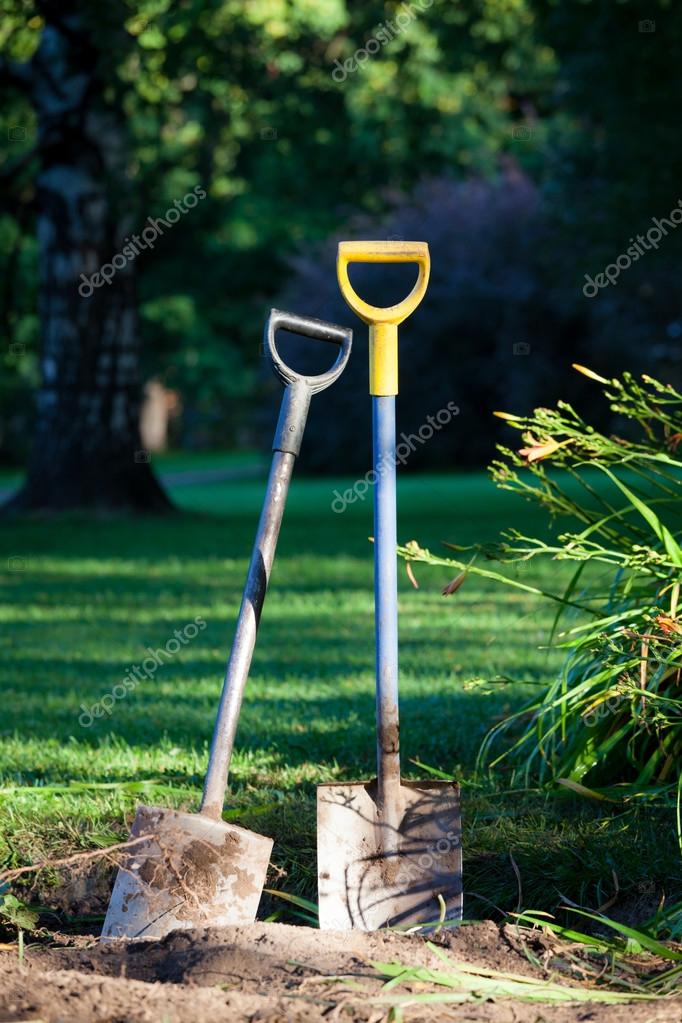 depositphotos_75817637-stock-photo-two-shovels-in-ground.jpg