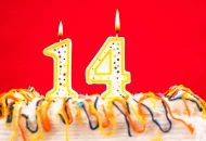 stock-photo-12101191-decorated-cake-with-number-14-burning-candles-jpg.258242